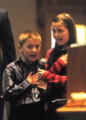 Speaker of the House Mark Ferrandino's nephew and niece, Owen and Abbey, lead the Colorado House of Representatives in the Pledge of Allegiance Jan. 9. Photo by Evan Semon/Out Front 