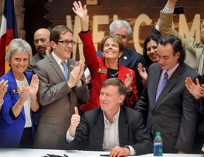 Gov. John Hickenlooper signs civil unions into law in Colorado.