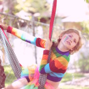 Transgender Youth Don’t Regret Transitioning: a line up of rainbow lego people in front of a lego rainbow flag