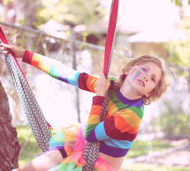 Transgender Youth Don’t Regret Transitioning: a line up of rainbow lego people in front of a lego rainbow flag