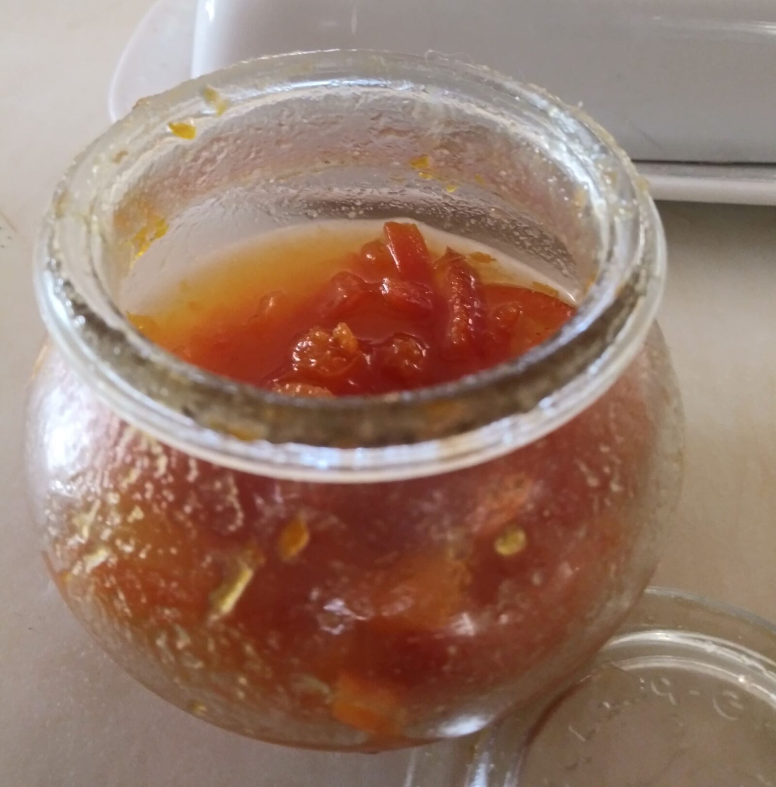 small glass jar containing marmalade