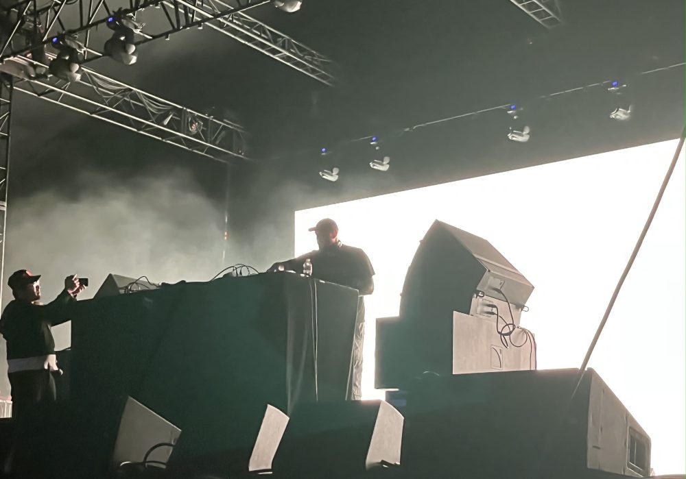 Portola Festival artist Kenny Beats at the decks, having his picture taken by festival staff