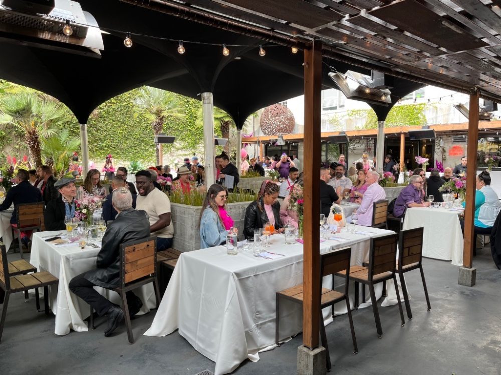 wide shot of all the guests at the table dining set up
