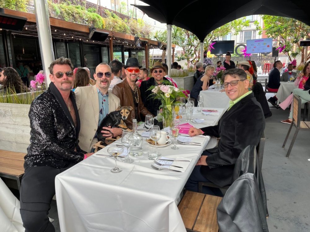 queer guests sitting at their table