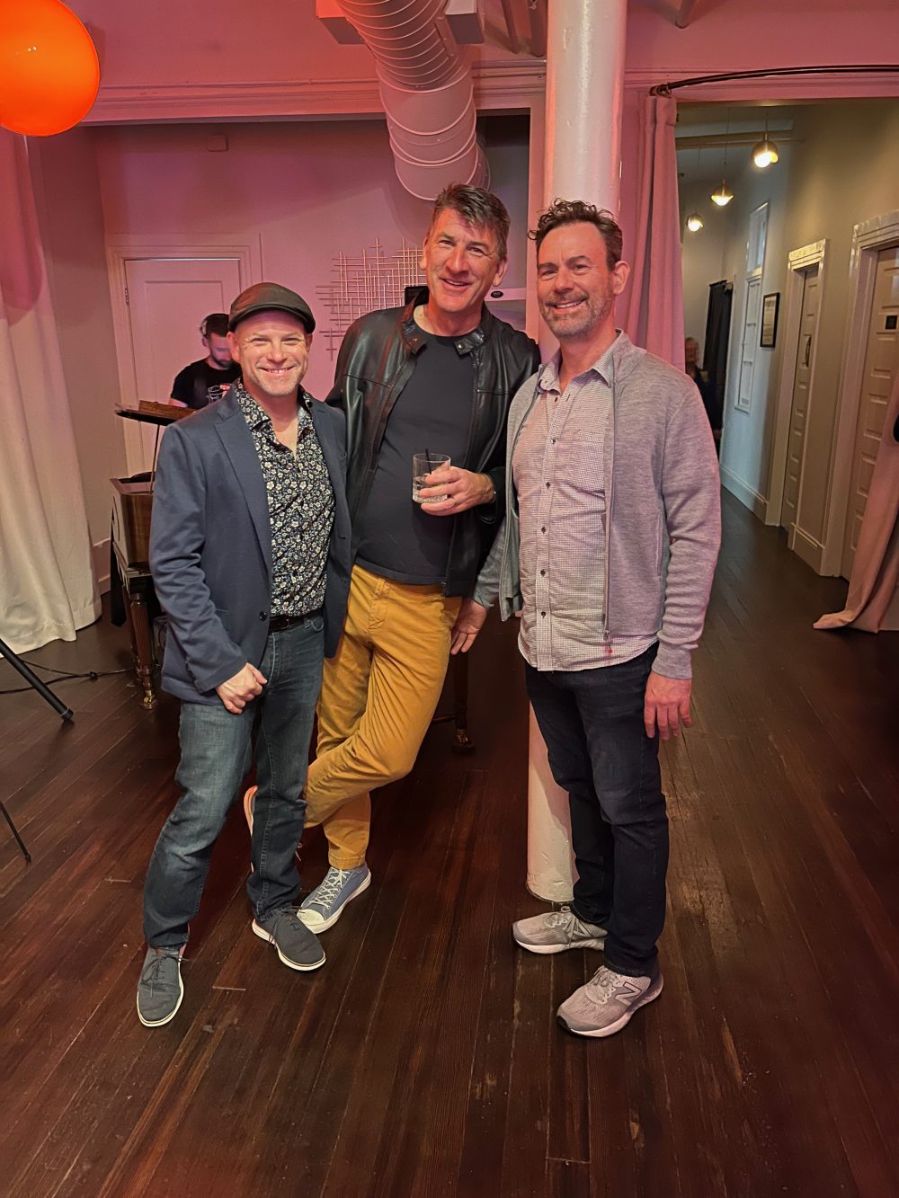 3 amab queers pose together