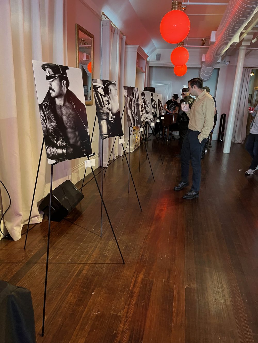 A wide shot of Wigler's photos set up on multiple easels