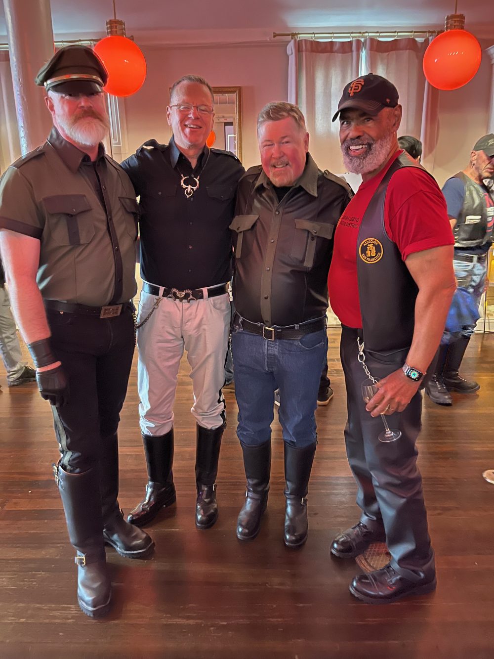 4 amab leather queers pose together