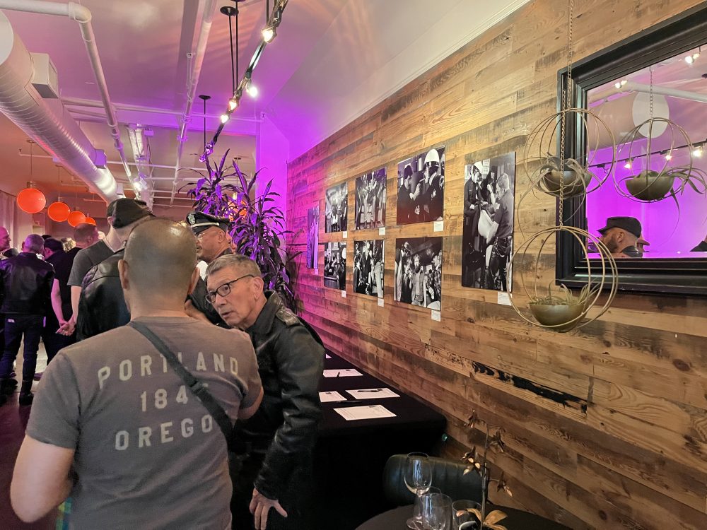 wide shot of Wigler's photos mounted on the wall