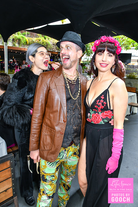 3 queers pose together with excited, silly, expressions on their face