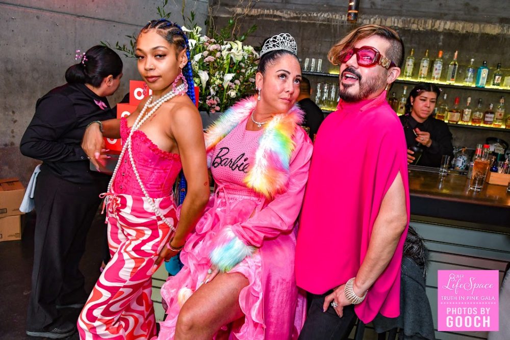 2 afab and one amab queers, all wearing hot pink