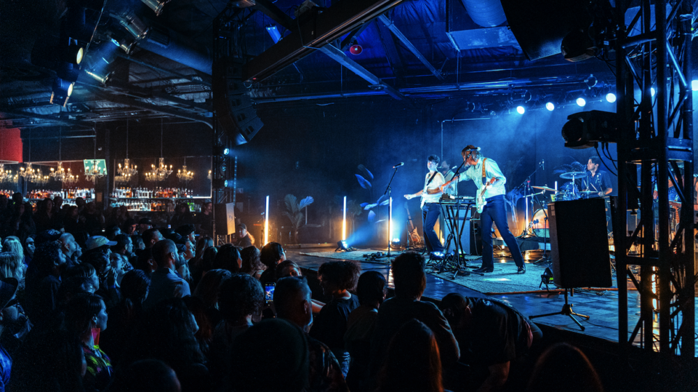 Poolside performs in front of the audience