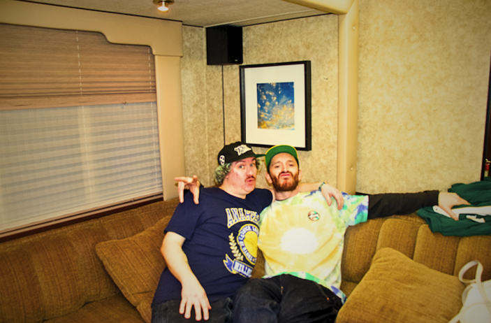 John and Alex of Little Stranger seated in their trailer