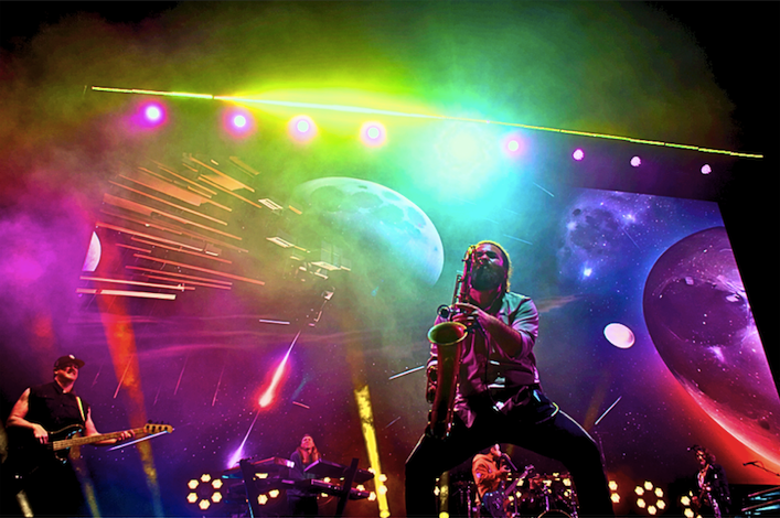 close up of Rebelution's saxophone player