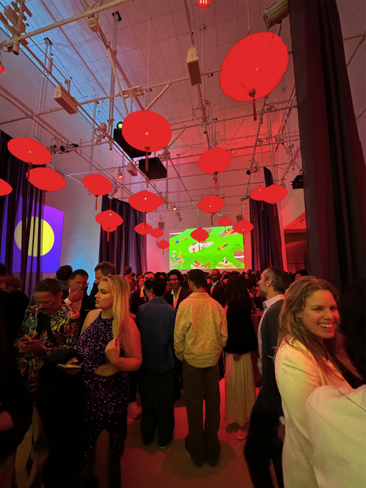 red lanterns hang from a lounge ceiling