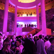 a crowd shot in the main lobby area with the grand staircase in the background