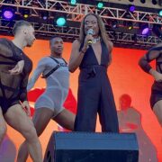 billy porter on the main stage with 3 backup dancers in the background