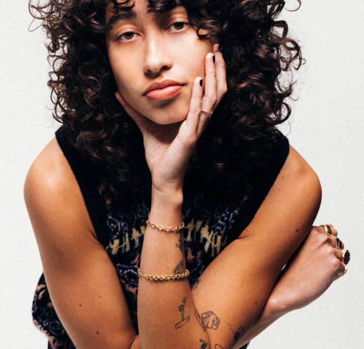 portrait of towa with her head resting in her palm