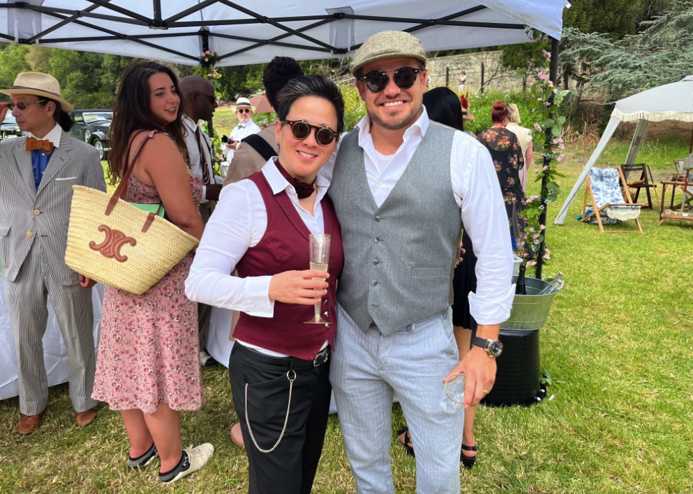 picnicers pose in vests and round sunglasses
