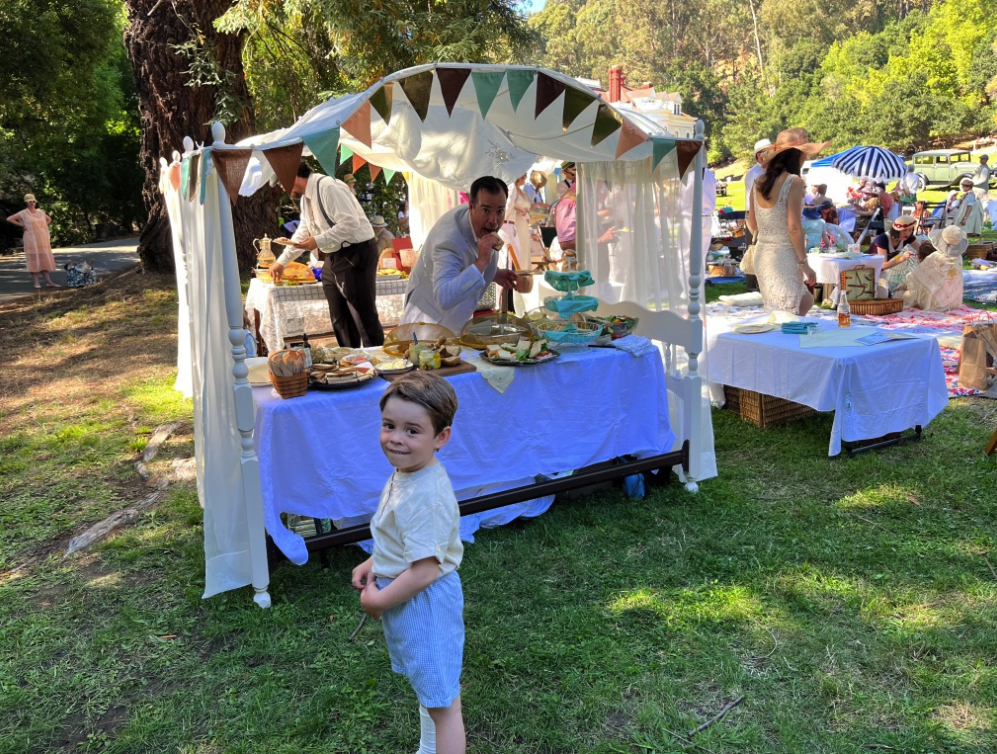 a vintage buffet spread with an elaborate canopy top