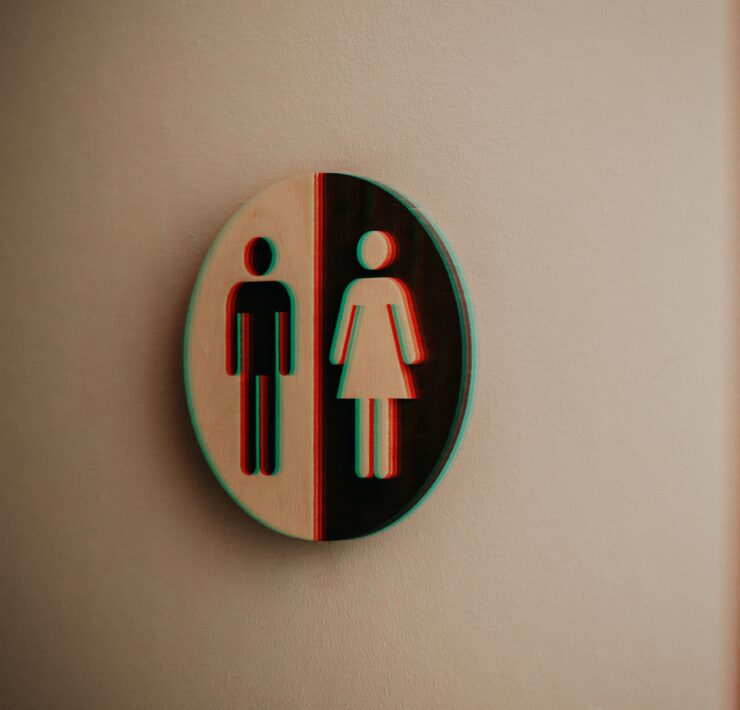 A blurry gender neutral bathroom sign, a much debated topic in politically motived transgender bathroom bans.