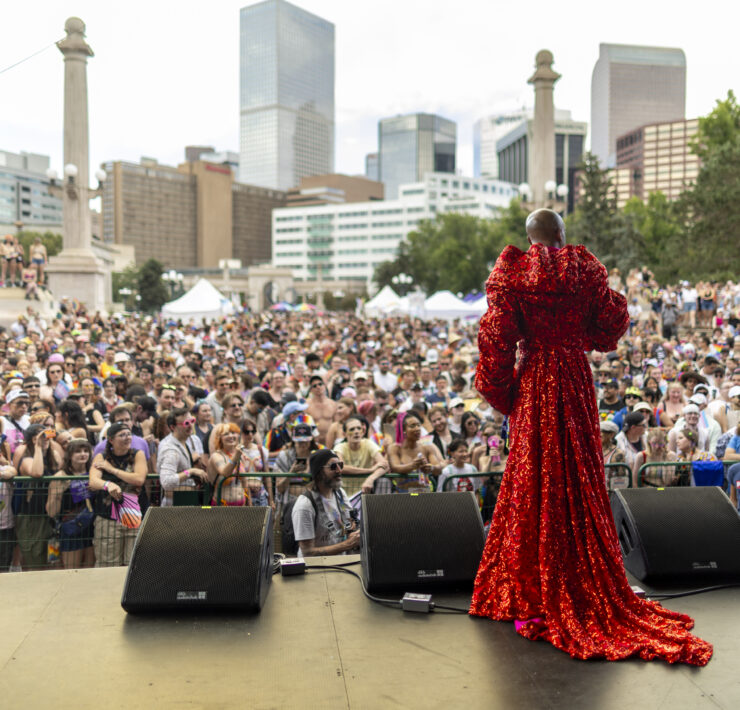 Looking out over the crowd at Pride with the Denver skyline behind