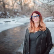 Brianna Titone next to a snowy stream