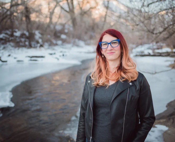 Brianna Titone next to a snowy stream